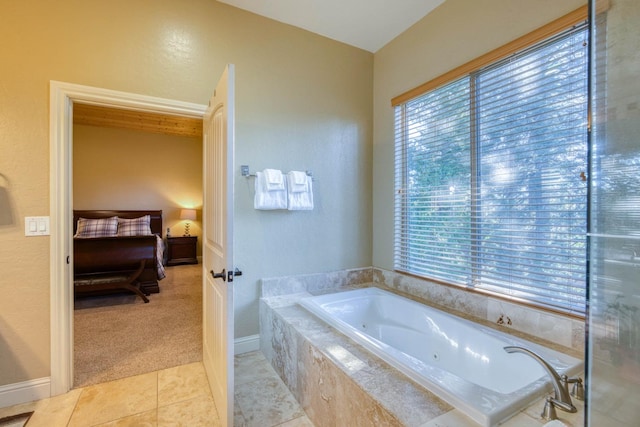 bathroom featuring tile patterned floors and tiled tub