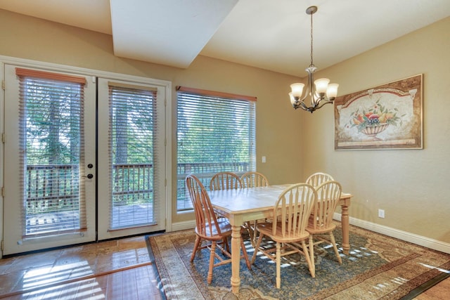 dining area featuring a notable chandelier and a healthy amount of sunlight