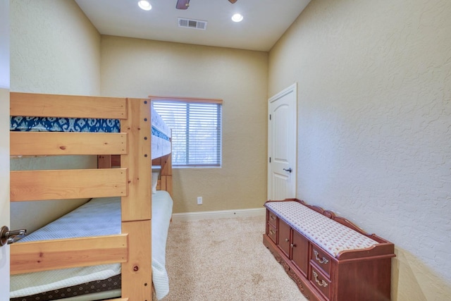 carpeted bedroom with ceiling fan