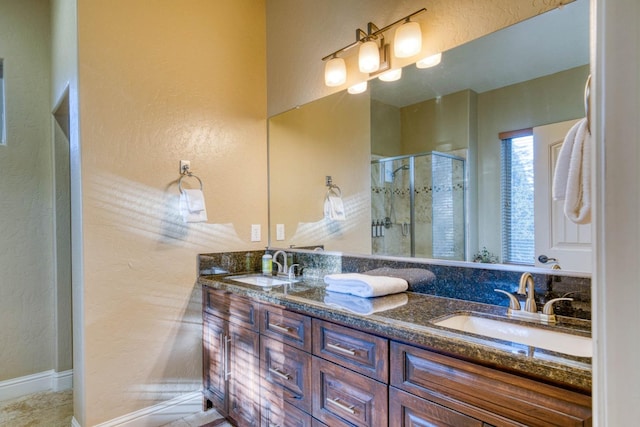 bathroom featuring vanity and an enclosed shower