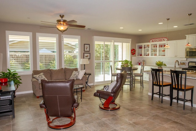 living room featuring ceiling fan