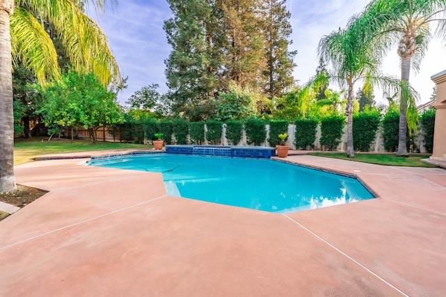 view of swimming pool with a patio area