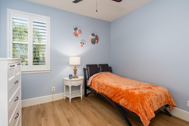 bedroom featuring light hardwood / wood-style floors and ceiling fan