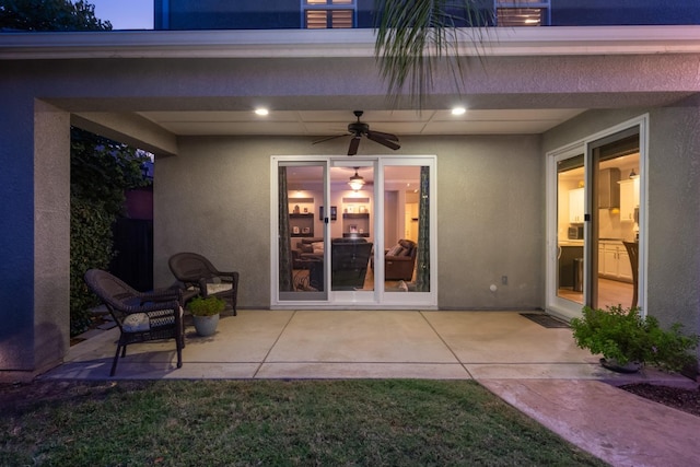 view of patio / terrace featuring ceiling fan