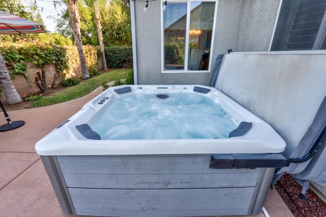 view of patio / terrace featuring a hot tub