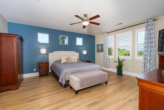 bedroom featuring light hardwood / wood-style floors and ceiling fan