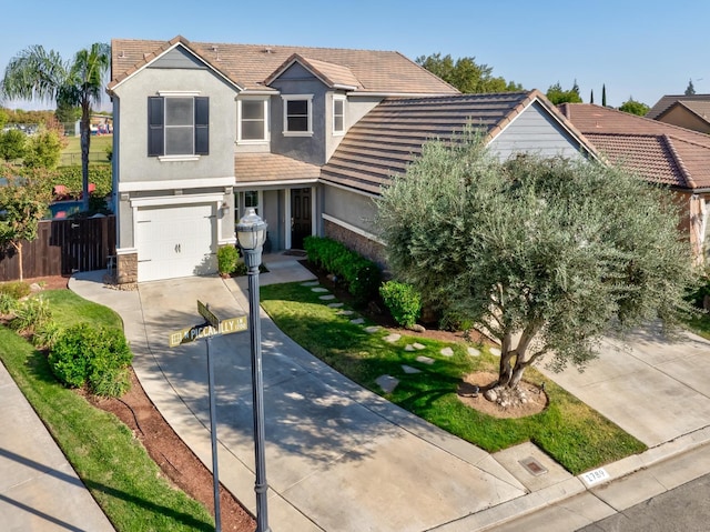 view of front property with a garage and a front lawn