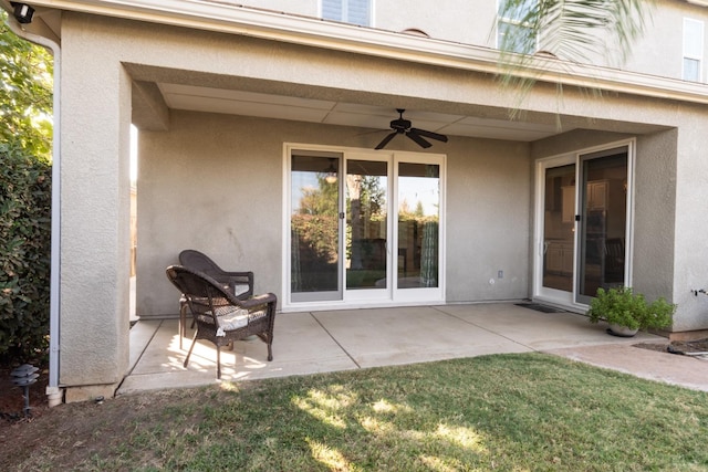 exterior space featuring ceiling fan