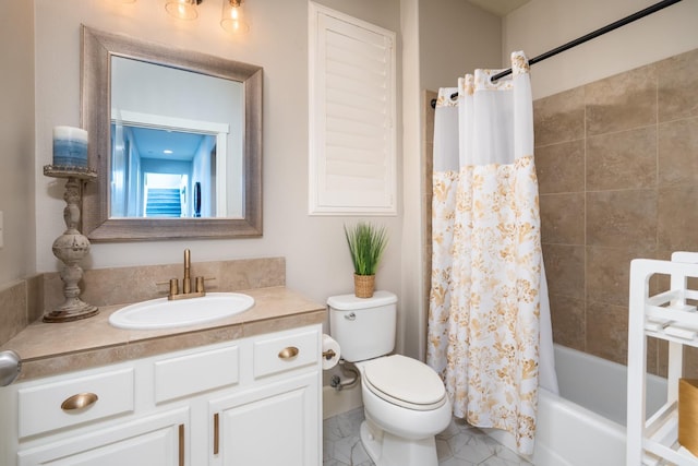 full bathroom featuring vanity, shower / bath combo, and toilet