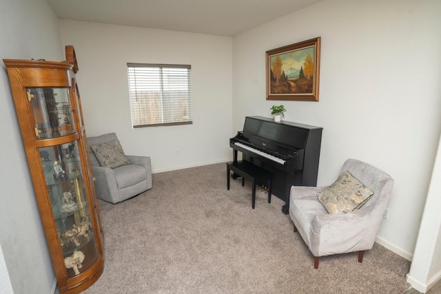 sitting room featuring light colored carpet