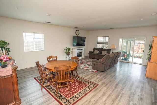 dining space with a healthy amount of sunlight and light wood-type flooring