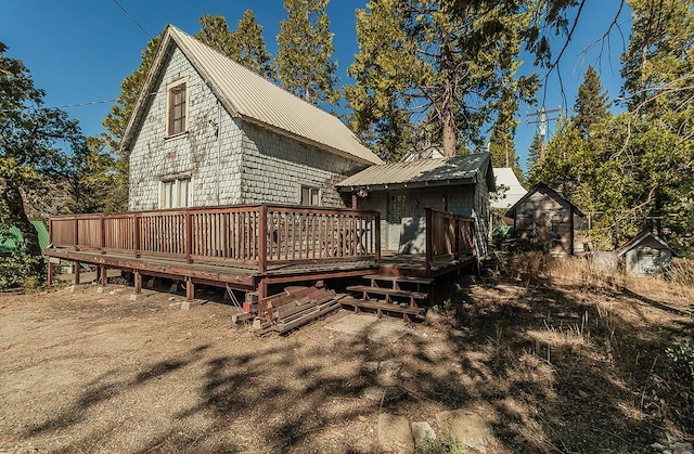 back of property featuring a deck