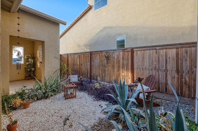 view of yard with a patio and a fenced backyard