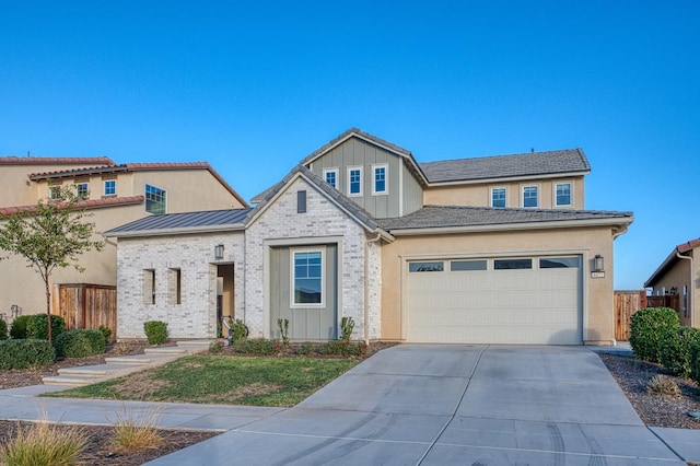 view of front facade featuring fence, a garage, stucco siding, and driveway