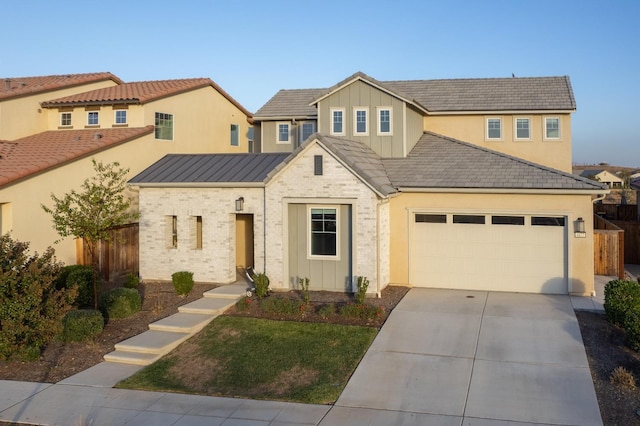 view of front of home with fence, concrete driveway, a garage, a front yard, and board and batten siding