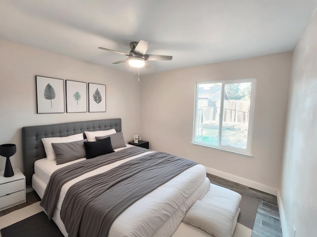 bedroom with hardwood / wood-style floors and ceiling fan