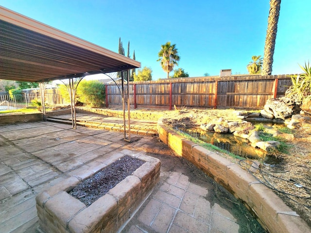 view of patio featuring a fire pit