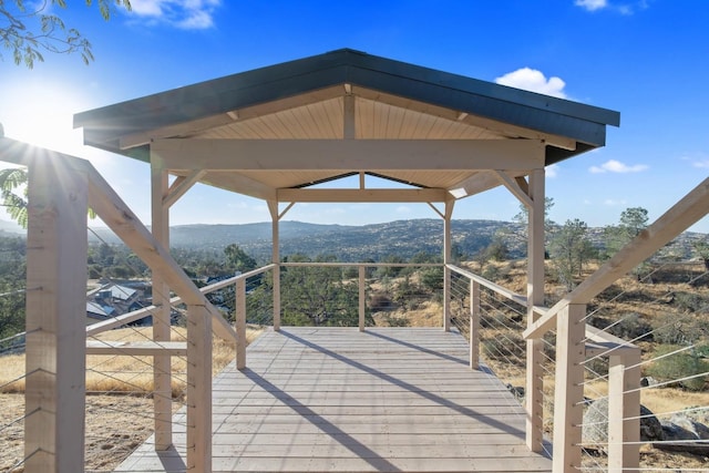 wooden terrace with a gazebo and a mountain view