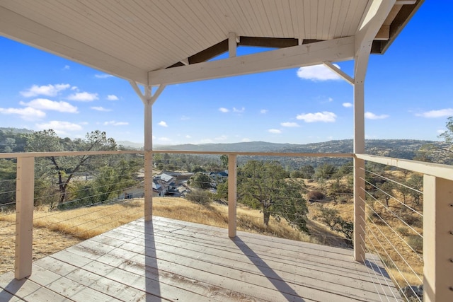 wooden terrace with a mountain view