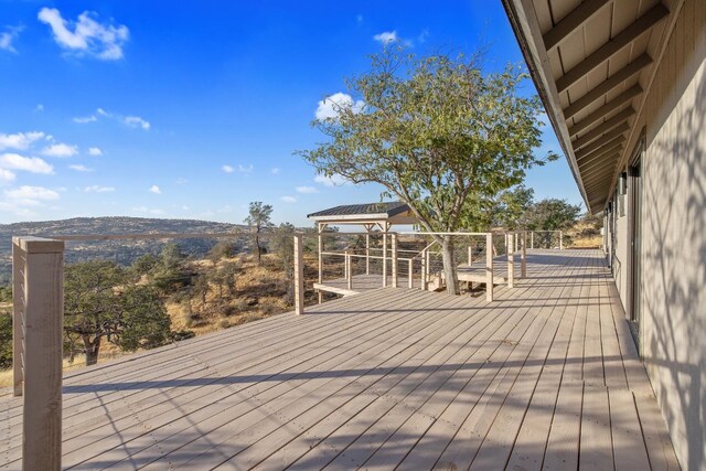 wooden terrace with a gazebo