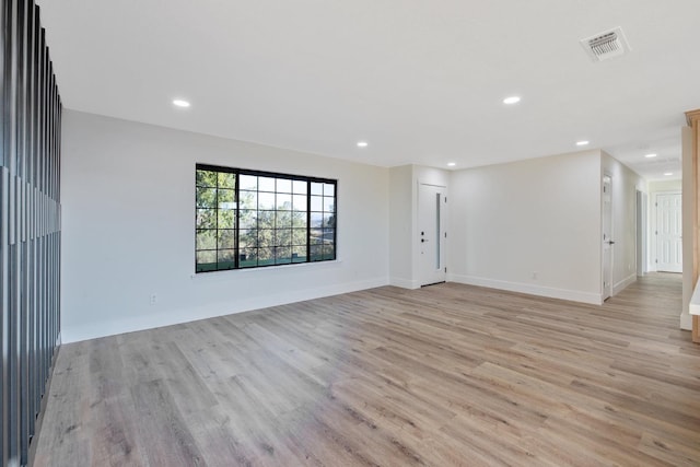 unfurnished room featuring light hardwood / wood-style flooring