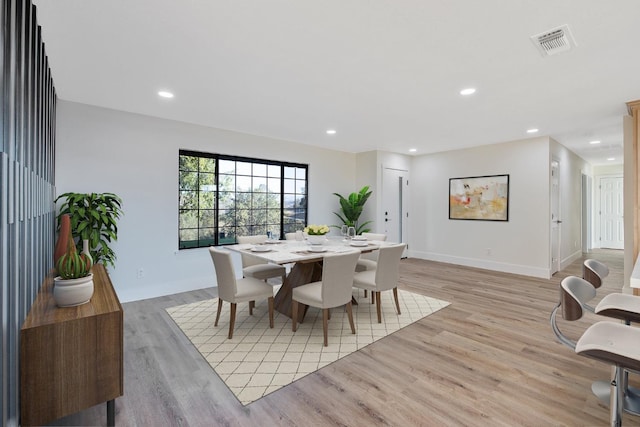 dining area with light wood-type flooring