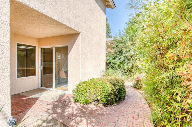 entrance to property with a patio area