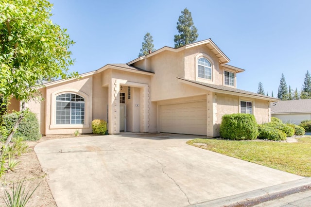 view of front facade featuring a front yard and a garage