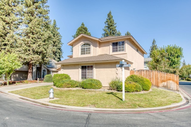 front facade with a front yard