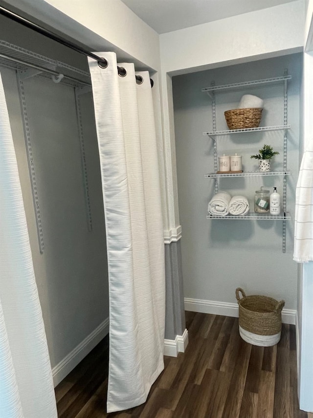 bathroom with hardwood / wood-style flooring