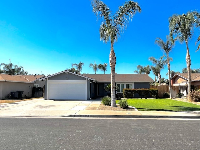 ranch-style home featuring a front yard and a garage