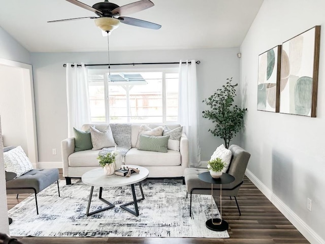 living room with hardwood / wood-style floors, ceiling fan, and lofted ceiling