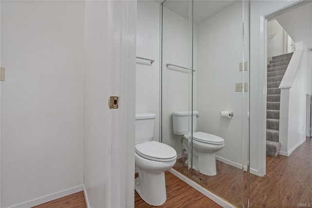 49400 River Park Rd Unit 17, Oakhurst, CA 93644 - bathroom featuring toilet, wood finished floors, and baseboards
