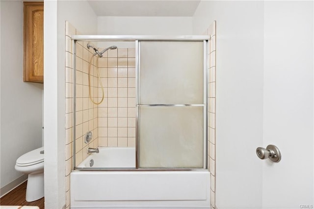49400 River Park Rd Unit 17, Oakhurst, CA 93644 - bathroom featuring toilet, combined bath / shower with glass door, and wood finished floors