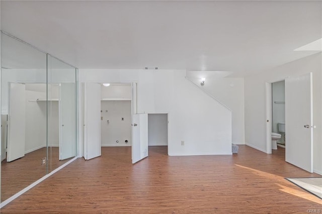 49400 River Park Rd Unit 17, Oakhurst, CA 93644 - unfurnished living room with wood finished floors and baseboards