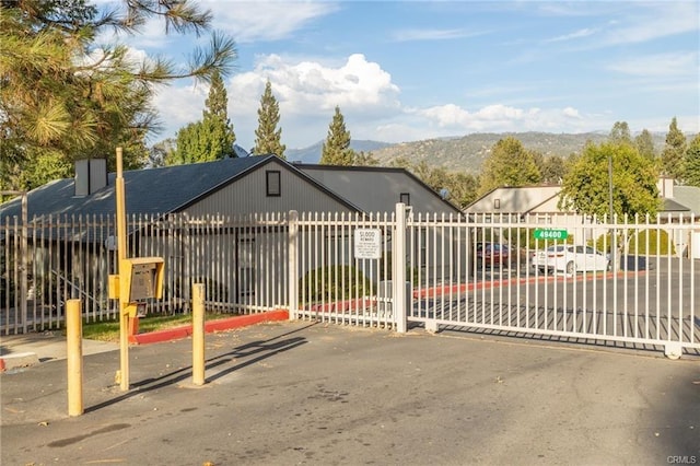 view of gate with a mountain view