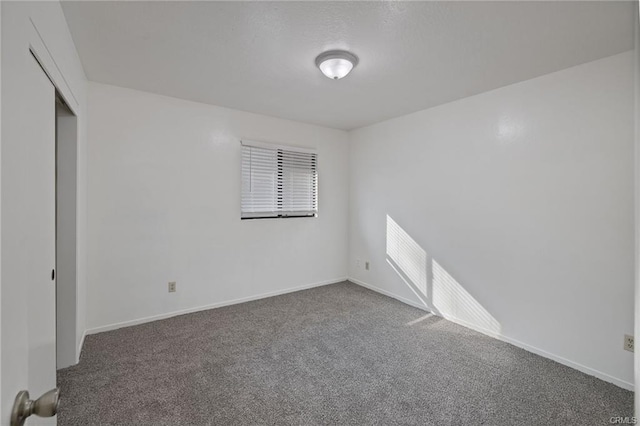 49400 River Park Rd Unit 17, Oakhurst, CA 93644 - unfurnished bedroom featuring carpet floors, baseboards, and a closet