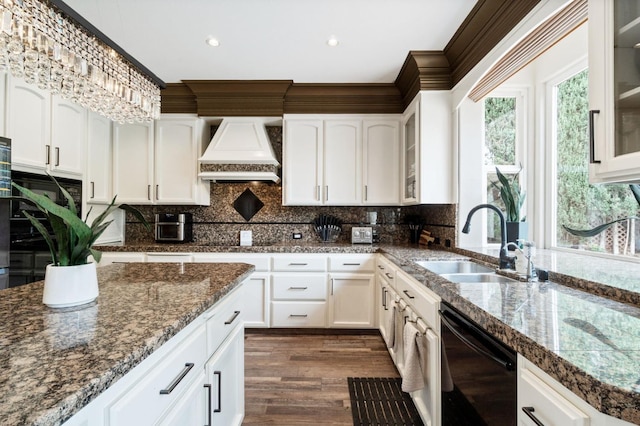 kitchen featuring sink, custom range hood, dishwasher, and white cabinets