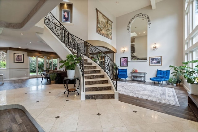 tiled entrance foyer featuring ornamental molding