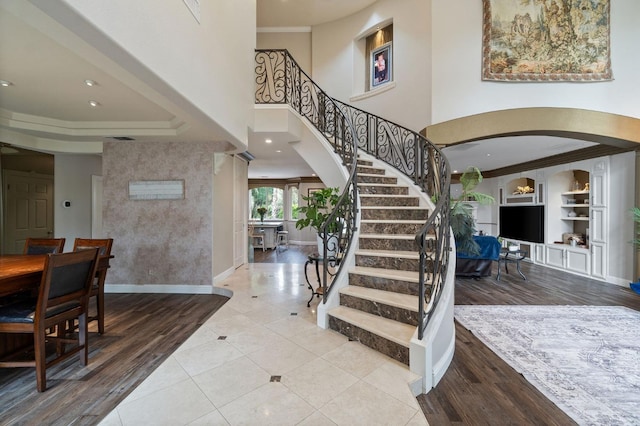 foyer entrance featuring ornamental molding and tile patterned floors