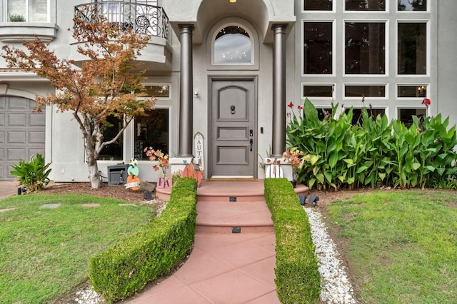 doorway to property with a lawn