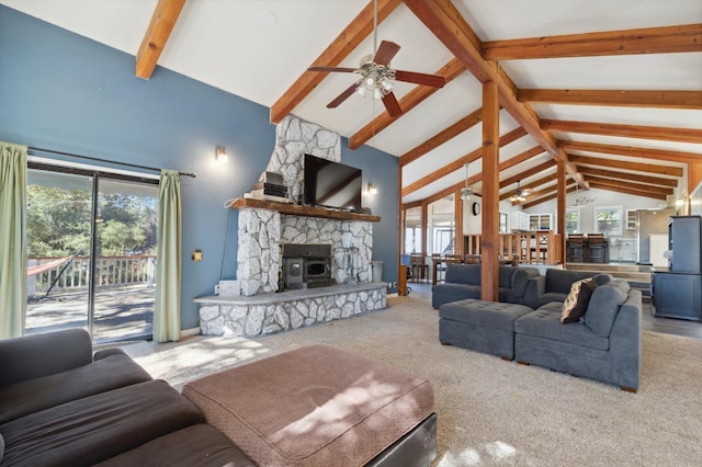 carpeted living room featuring beamed ceiling, a fireplace, high vaulted ceiling, and ceiling fan