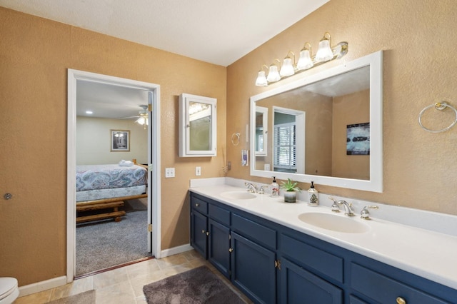 bathroom featuring vanity, ceiling fan, toilet, and tile patterned floors