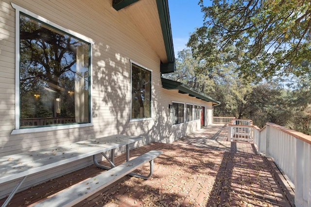 view of side of home with a deck