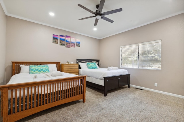 carpeted bedroom with ceiling fan and ornamental molding