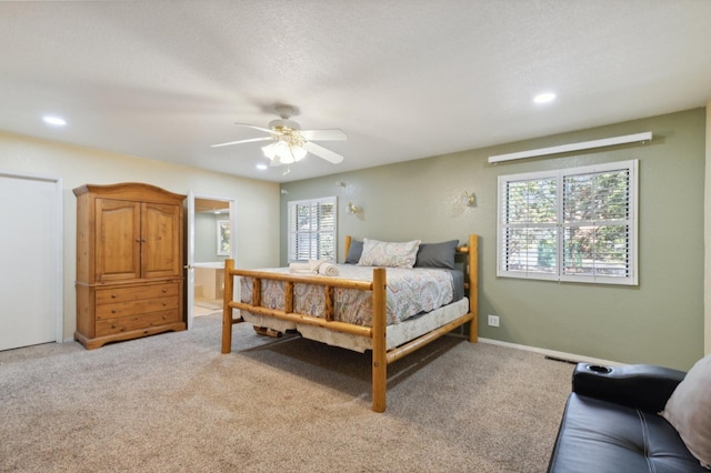 bedroom with ceiling fan, a textured ceiling, and light colored carpet