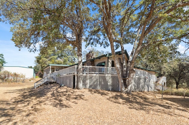 exterior space featuring a wooden deck