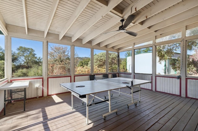 unfurnished sunroom with beamed ceiling and ceiling fan