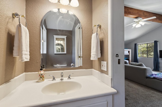 bathroom featuring vanity, ceiling fan, lofted ceiling, and toilet