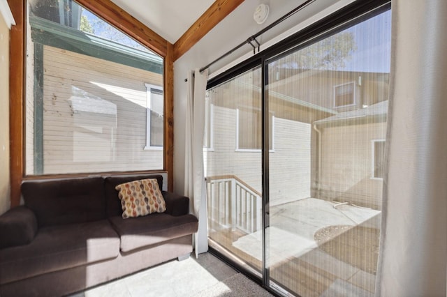 sunroom / solarium featuring lofted ceiling